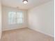 Bright bedroom featuring neutral carpet, light walls, and a large window for ample natural light at 529 Ridge View Crossing Xing, Woodstock, GA 30188