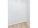 A carpeted walk-in closet featuring white walls and a single rack for hanging clothing at 529 Ridge View Crossing Xing, Woodstock, GA 30188