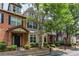 Charming townhomes featuring varied facades and manicured landscaping create inviting curb appeal at 529 Ridge View Crossing Xing, Woodstock, GA 30188