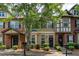 Attractive townhome exteriors with neat landscaping, creating a visually appealing street scene at 529 Ridge View Crossing Xing, Woodstock, GA 30188