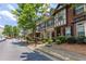 Row of townhouses with manicured front yards and street parking, perfect for suburban living at 529 Ridge View Crossing Xing, Woodstock, GA 30188
