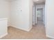 Upstairs hallway with neutral paint and carpet with access to rooms at 529 Ridge View Crossing Xing, Woodstock, GA 30188