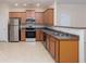 Bright kitchen features stainless steel appliances, wood cabinets, and a subway tile backsplash at 529 Ridge View Crossing Xing, Woodstock, GA 30188