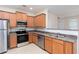 Bright kitchen features stainless steel appliances, wood cabinets, and a subway tile backsplash at 529 Ridge View Crossing Xing, Woodstock, GA 30188