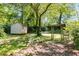 Backyard with a small shed, an arbor and an old yard bench at 1405 May Se Ave, Atlanta, GA 30316