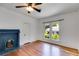 Bedroom featuring hardwood floors, a window, and a decorative blue fireplace at 1405 May Se Ave, Atlanta, GA 30316