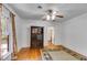Bright bedroom with hardwood floors, a window, a ceiling fan, and built-in cabinets at 1405 May Se Ave, Atlanta, GA 30316