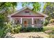 Charming home exterior featuring a covered front porch, and mature trees at 1405 May Se Ave, Atlanta, GA 30316
