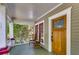 View of the front porch featuring a wooden front door with art deco window panes at 1405 May Se Ave, Atlanta, GA 30316