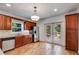 Modern kitchen features dark wood cabinets, granite countertops, and stainless steel appliances at 1405 May Se Ave, Atlanta, GA 30316