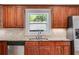 Close-up of the kitchen sink area showing wood cabinets and granite countertops at 1405 May Se Ave, Atlanta, GA 30316