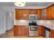 Stainless steel appliances, light countertops, and wood cabinets are the highlight of this kitchen at 1405 May Se Ave, Atlanta, GA 30316