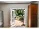 Kitchen with cherry cabinets, a stainless refrigerator, and access to an outdoor deck and backyard at 1405 May Se Ave, Atlanta, GA 30316