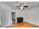Bright living room featuring hardwood floors, a piano, and a closet at 1405 May Se Ave, Atlanta, GA 30316
