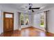 Bright living room featuring hardwood floors, decorative windows, and a wooden front door at 1405 May Se Ave, Atlanta, GA 30316