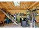 Interior view of a well-organized shed with shelves, tools, ladder, and a skylight for natural light at 1405 May Se Ave, Atlanta, GA 30316