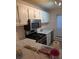 Bright kitchen featuring white cabinets, modern appliances, and laminate countertops at 206 River Run Dr, Atlanta, GA 30350