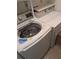 Modern white washer and dryer in a well-maintained laundry area ready for moving in at 206 River Run Dr, Atlanta, GA 30350