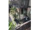 Cozy patio with roses, featuring a wooden deck above for outdoor relaxation and BBQ area at 206 River Run Dr, Atlanta, GA 30350