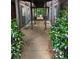 Pathway between buildings with greenery and natural light at 206 River Run Dr, Atlanta, GA 30350