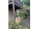 Exterior shot of yard with rose bushes, hardscape, and multi-level wooden decks at 206 River Run Dr, Atlanta, GA 30350