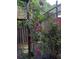 Beautiful red rose bushes climbing up the deck in this exterior yard view at 206 River Run Dr, Atlanta, GA 30350