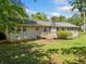 Home's backyard features a deck, brick exterior, and ample lawn space at 265 Tamea Trl, Covington, GA 30014
