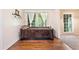 Well-lit bedroom features hardwood floors and a view of the front yard with a large window at 265 Tamea Trl, Covington, GA 30014