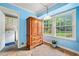 Dining room featuring an armoire and lots of natural light from the windows at 265 Tamea Trl, Covington, GA 30014