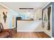 Bright kitchen and bar area features wainscoting, white cabinets, and a serving area at 265 Tamea Trl, Covington, GA 30014