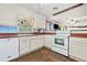 Kitchen with white cabinets and a white oven at 265 Tamea Trl, Covington, GA 30014