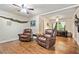 Comfortable living room showcasing hardwood floors and a view into the bedroom with natural light at 265 Tamea Trl, Covington, GA 30014
