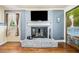 Charming living area with a brick fireplace, providing a cozy focal point and warmth at 265 Tamea Trl, Covington, GA 30014