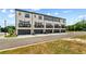 Exterior view of a row of brick townhomes at 445 Breccia Run, Mcdonough, GA 30253