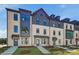 Beautiful townhome exhibits modern brickwork, large windows, and simple landscaping, enhancing curb appeal at 445 Breccia Run, Mcdonough, GA 30253