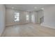 Spacious living area with beautiful floors, recessed lighting and natural light from the window and door at 445 Breccia Run, Mcdonough, GA 30253