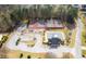 Aerial view showcasing the community pool, tennis courts, and well-manicured landscaping, enhancing the property's appeal at 6772 Blantyre Boulevard Blvd, Stone Mountain, GA 30087