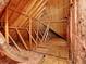 Exposed attic features wooden beams, insulation, ductwork, and plenty of potential storage space at 6772 Blantyre Boulevard Blvd, Stone Mountain, GA 30087