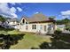 Spacious backyard with a well-maintained lawn and patio seating area at 6772 Blantyre Boulevard Blvd, Stone Mountain, GA 30087