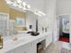 Bright bathroom offers dual sinks, large mirrors, separate shower and tub, and vanity lighting at 6772 Blantyre Boulevard Blvd, Stone Mountain, GA 30087