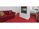 Bedroom features a fireplace, sitting area with couch, and plush red carpeting at 6772 Blantyre Boulevard Blvd, Stone Mountain, GA 30087