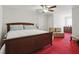 Spacious bedroom features a ceiling fan and a comfortable bed, complemented by stylish decor and lighting at 6772 Blantyre Boulevard Blvd, Stone Mountain, GA 30087