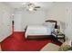 Spacious bedroom features a ceiling fan and a comfortable bed, complemented by stylish decor and natural lighting at 6772 Blantyre Boulevard Blvd, Stone Mountain, GA 30087