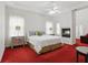 Bright bedroom features a ceiling fan, fireplace, and two large windows at 6772 Blantyre Boulevard Blvd, Stone Mountain, GA 30087