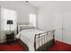 Bedroom featuring white walls, two windows, and simple decor with a bed at 6772 Blantyre Boulevard Blvd, Stone Mountain, GA 30087