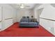 Bonus room with comfortable blue sofa and railing overlooking the lower floor at 6772 Blantyre Boulevard Blvd, Stone Mountain, GA 30087