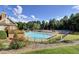 Inviting community pool surrounded by lounge chairs and tennis courts in a well-maintained recreational area at 6772 Blantyre Boulevard Blvd, Stone Mountain, GA 30087
