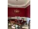 Elegant dining room with wainscoting, a modern chandelier, and a formal dining set at 6772 Blantyre Boulevard Blvd, Stone Mountain, GA 30087
