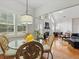 Bright dining area with hardwood floors and large windows, connected to the living room at 6772 Blantyre Boulevard Blvd, Stone Mountain, GA 30087
