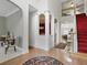 Spacious foyer with hardwood floors, high ceilings, a staircase, and view into other living areas at 6772 Blantyre Boulevard Blvd, Stone Mountain, GA 30087